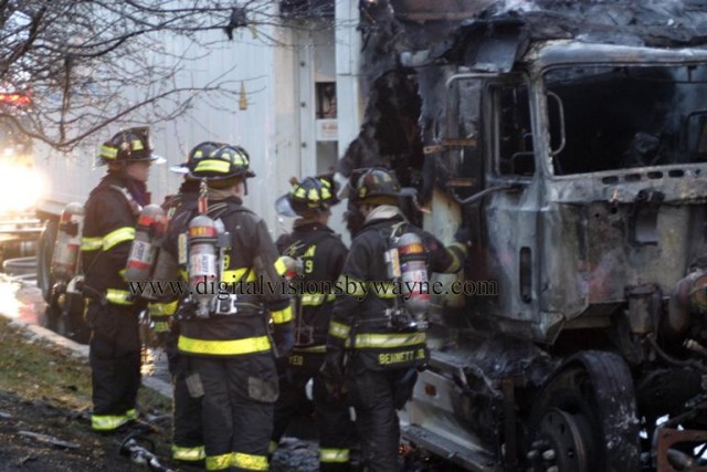 The troops take a rest after extinguishing a tractor trailer fire on Route 1 South at Ronson Road, December 2007.